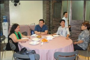 Asec. Gudmalin (in blue shirt) sharing a light moment with Dir. Tapispisan (left), ARD Condoy (2nd from right) and ARD Sto. Tomas (standing).