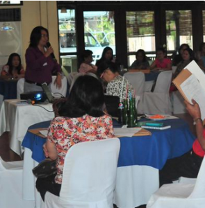 Ms. Elgin Mazo, Focal Person for the Family Sector, from DSWD Central Office, lays down the comprehensive programs and services under the Solo Parents' Welfare Act of 2000 before the solo parents present during the dialogue.