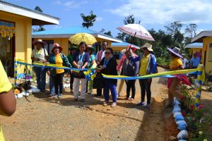 Dir. Tapispisan (center, in blue jeans) leads the ceremonial ribbon cutting in one of the three CSAP inauguration in Divilacan, Isabela. Joining her is Divilacan Mayor Florita R. Bulan (center, in white jeans), LGU officials and DSWD staff.