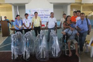 OIC ARD Lucia S. Alan, 2nd from left, with representatives of the Regional Council for Disability Affairs (RCDA) awards assistive devices to PWDs during the 38th NDPR Week celebration.